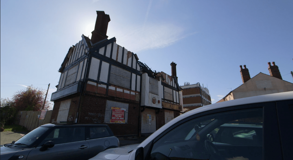View of The Bulls Head pub 2016 with caved in roof and windows boarded up.