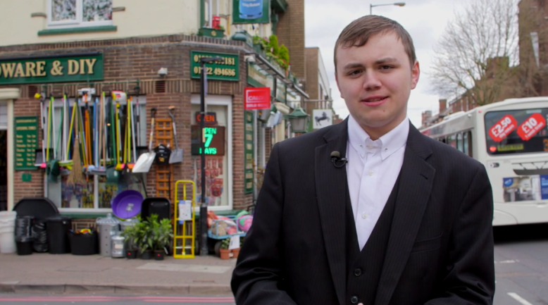 Student Ben outside Bloxwich Hardware 2016, formerly the George Inn. Hardward items hang outside the building.